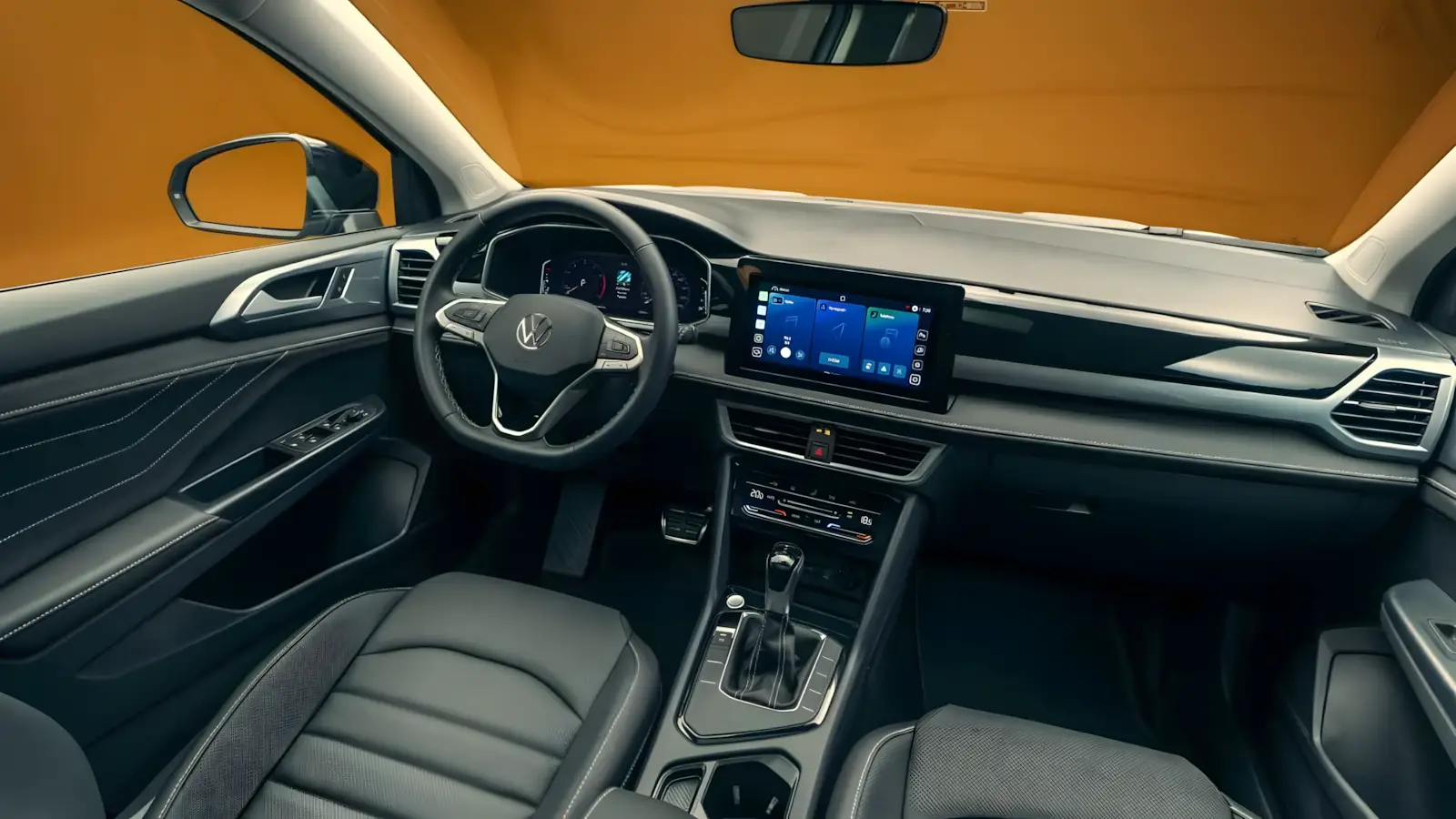 Interior do Volkswagen Taos 2026 com painel digital 10 polegadas e volante com comandos f&iacute;sicos